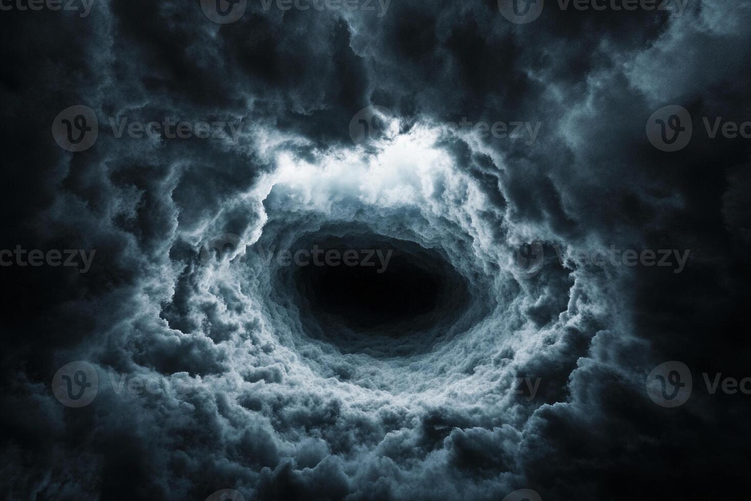 A black hole is seen in the sky with clouds photo