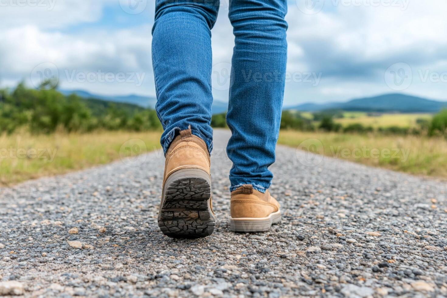 A person walking on a gravel road with their shoes on photo