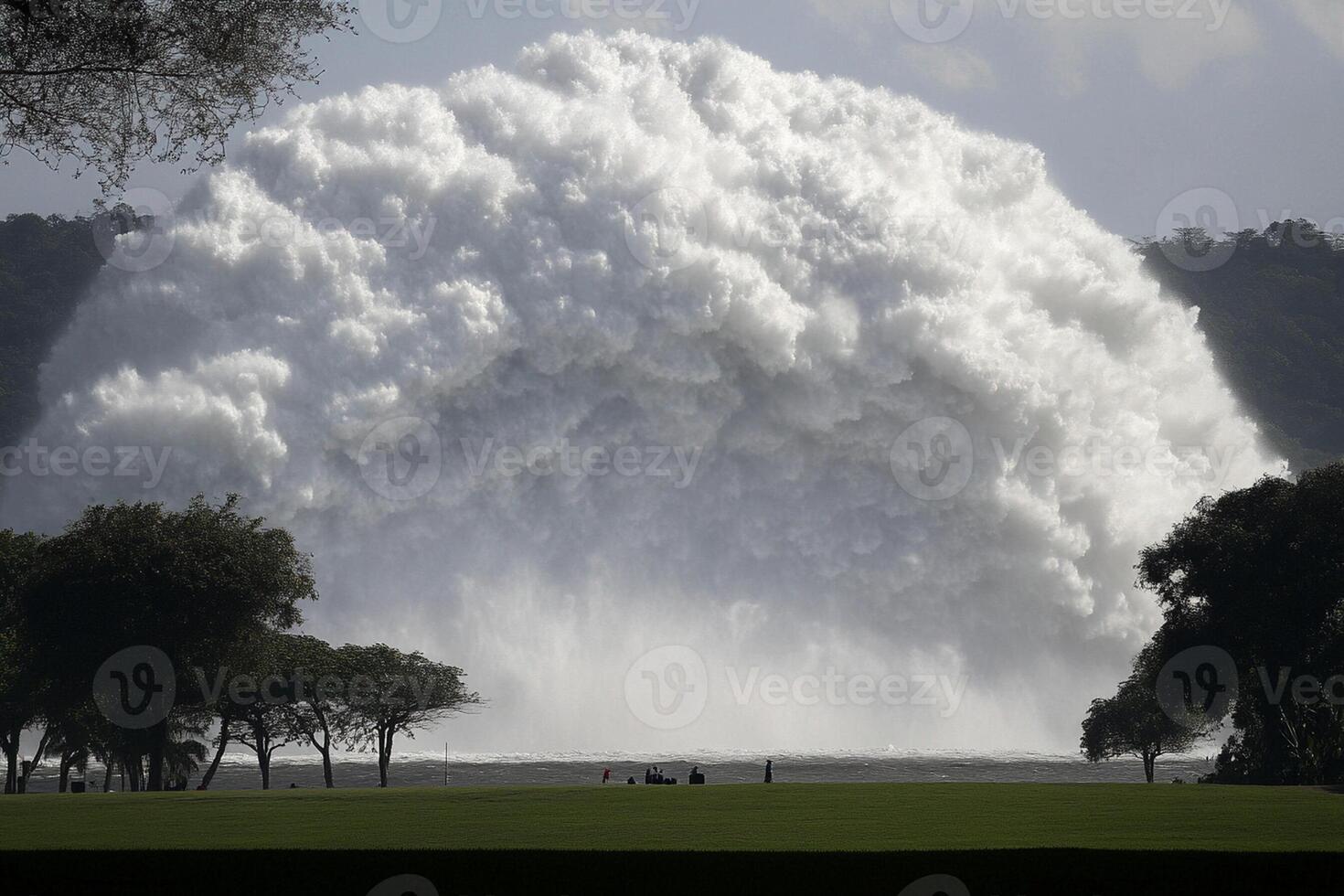 A large waterfall is being sprayed with water photo