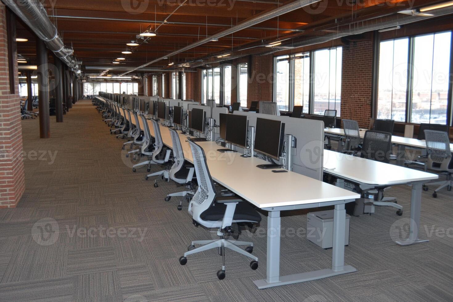 A large open room with desks and computers photo