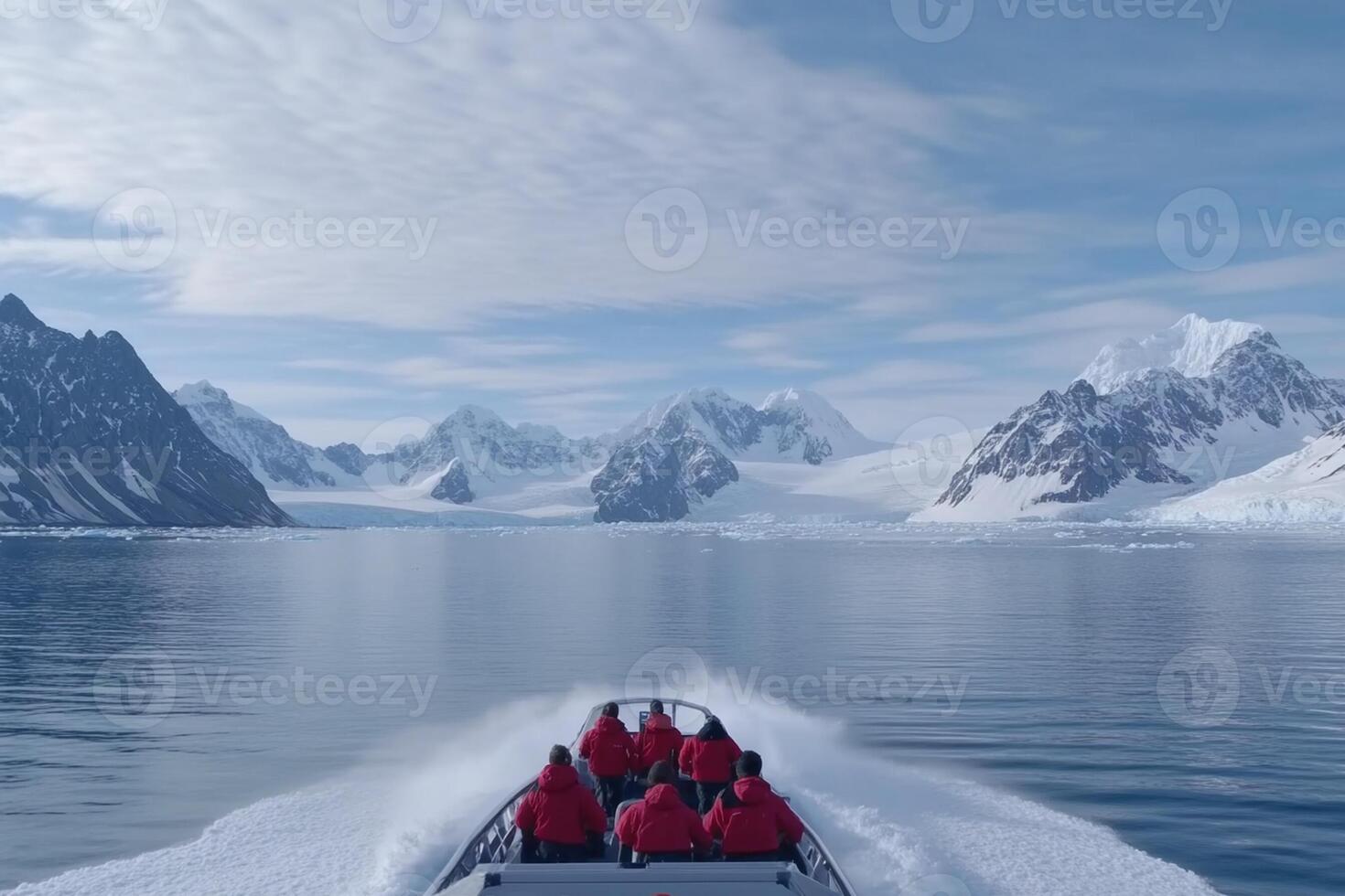 A group of people on a boat in the ocean with mountains in the background photo