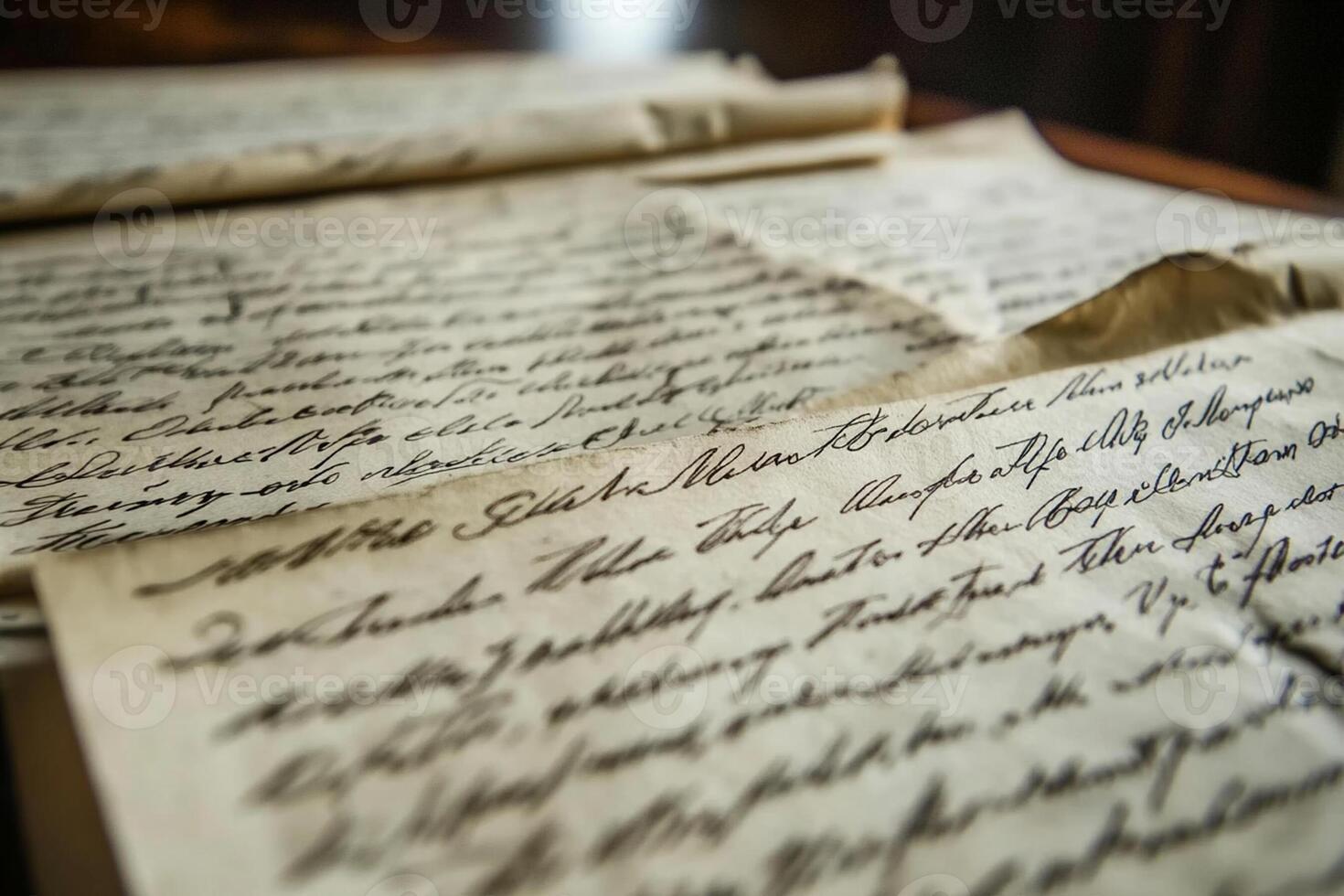 Old letters on a table with a pen and paper photo