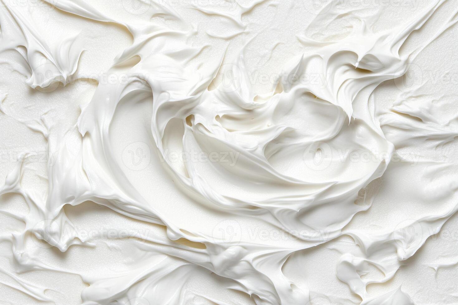 A close up of white frosting on a white surface photo