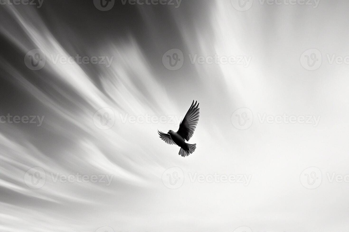 A black and white photo of a bird flying through the air
