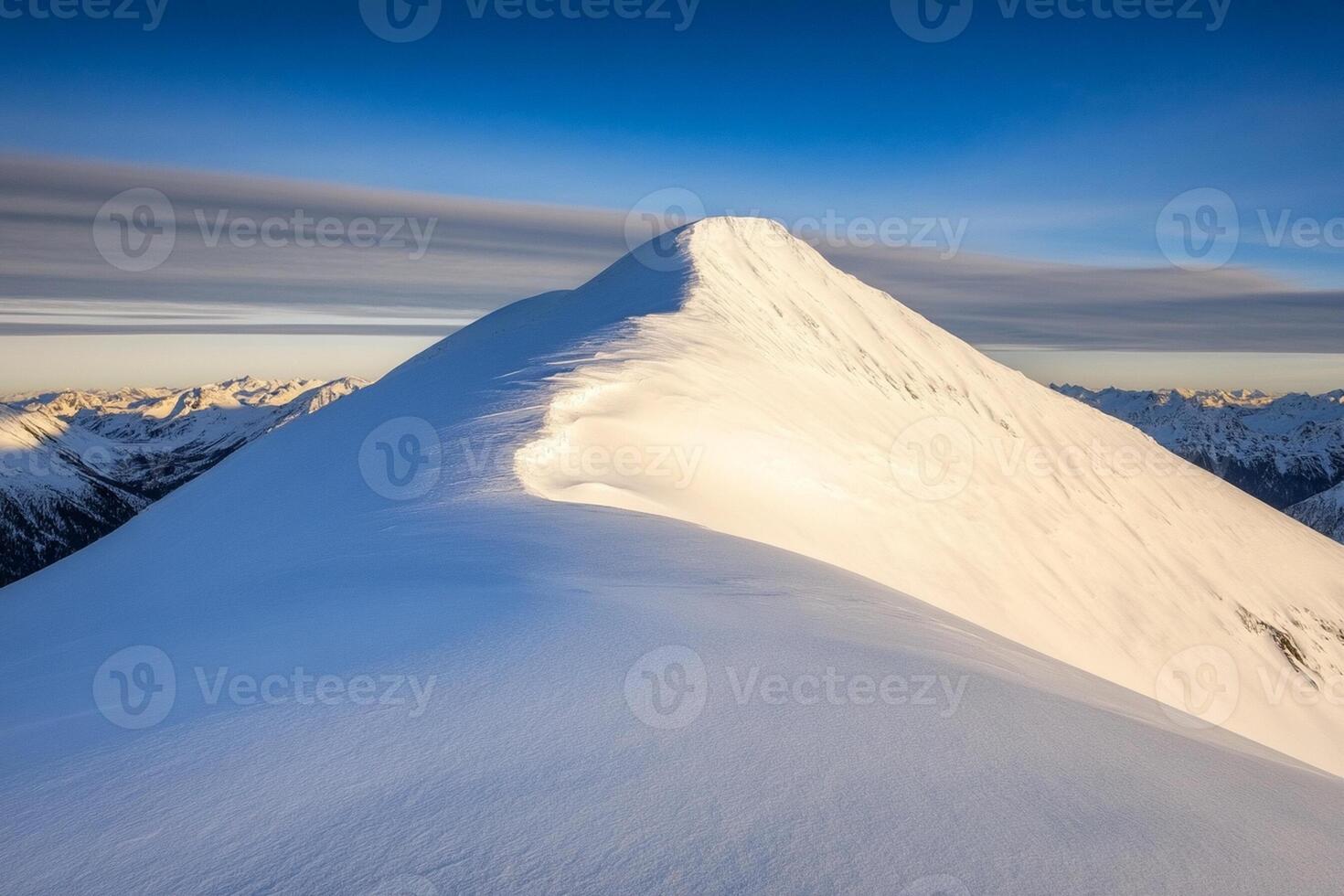 A snow covered mountain with a blue sky photo