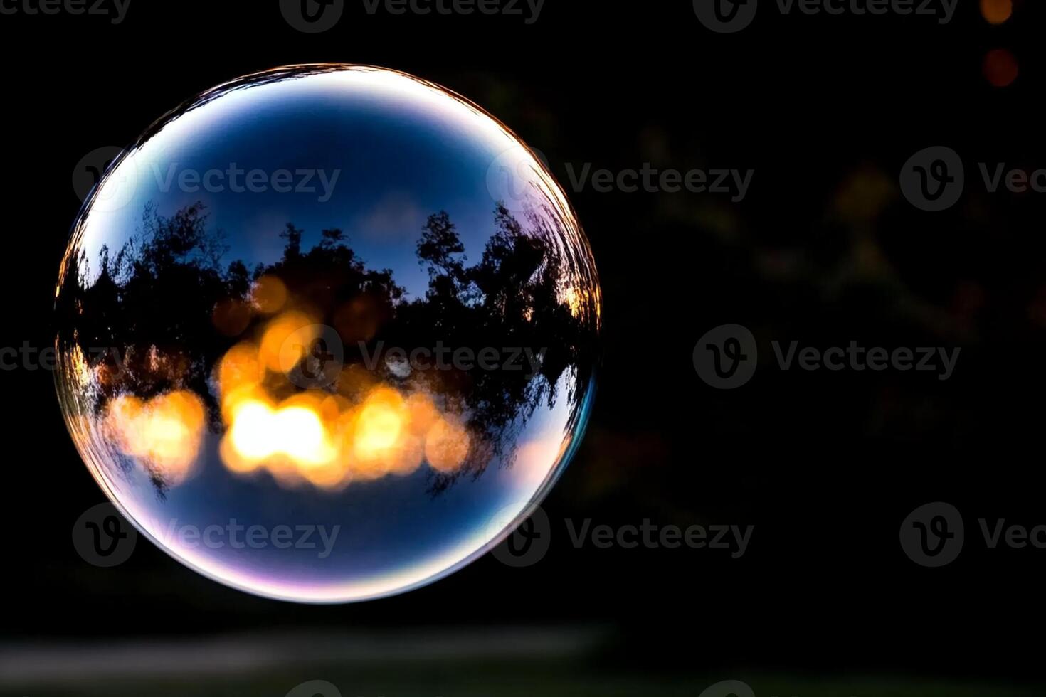 A large bubble with a reflection of the sky photo