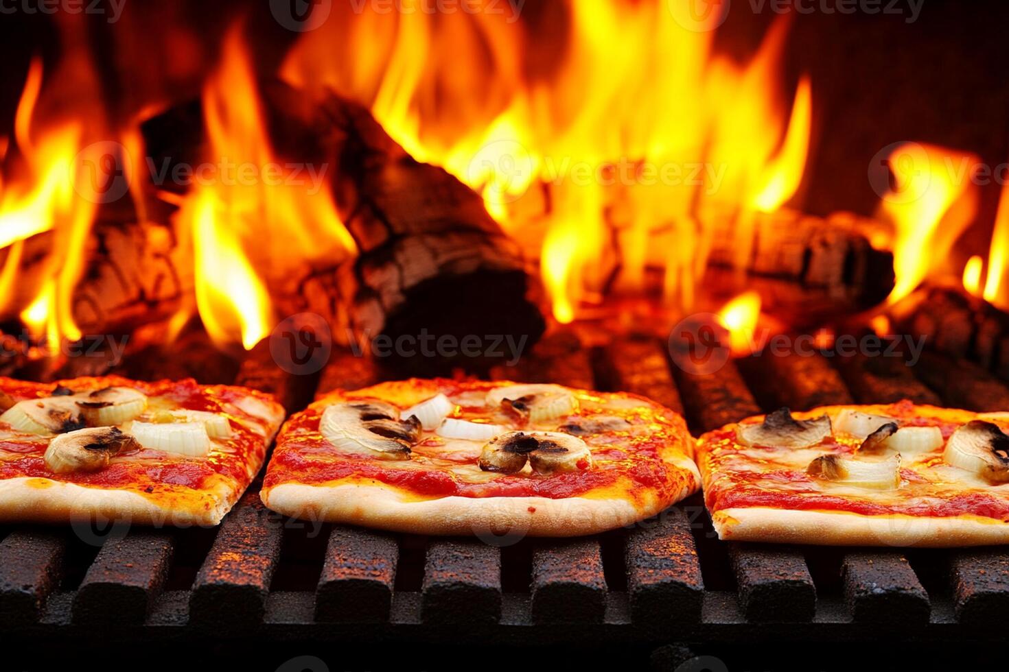 A grill with three pizzas on it photo