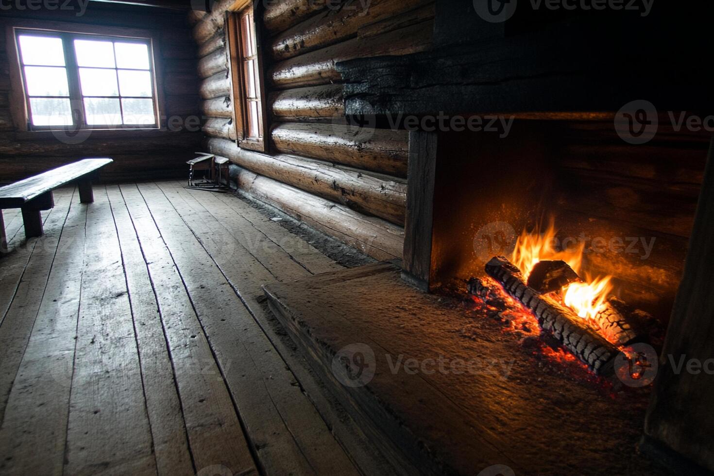 A log cabin with a fireplace and a bench in it photo