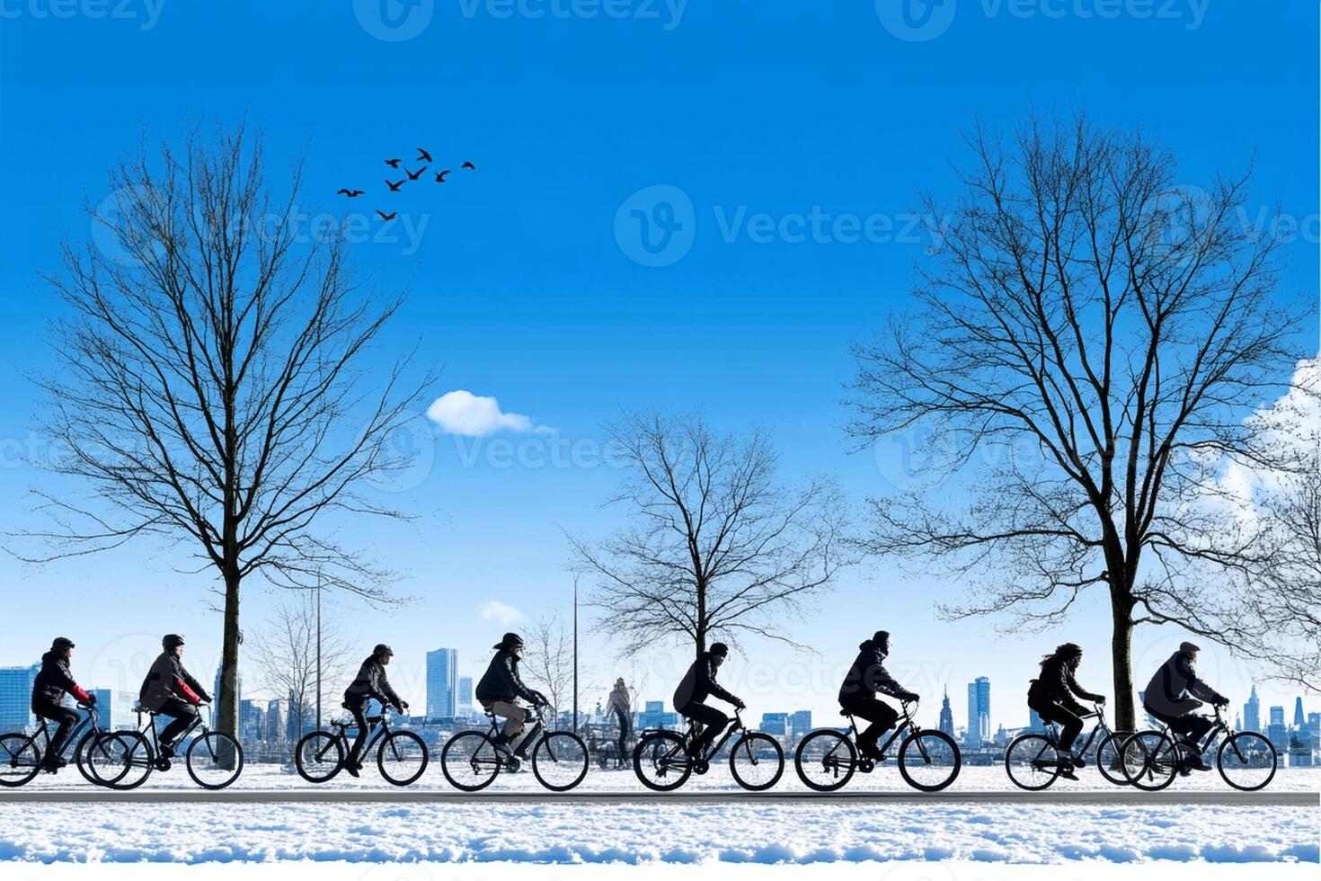 A group of people riding bicycles in the snow photo