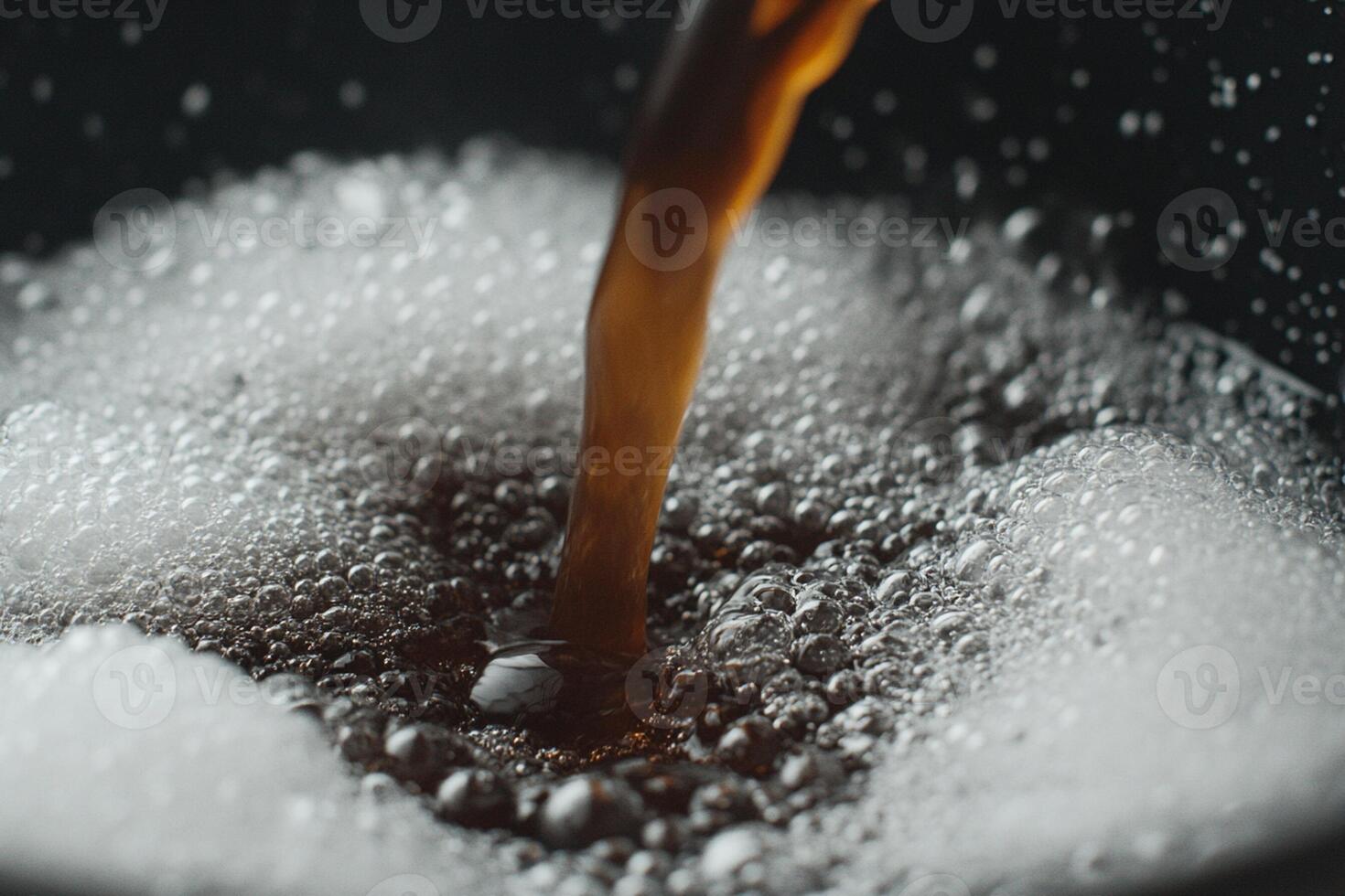 A close up of a cup of soda being poured photo