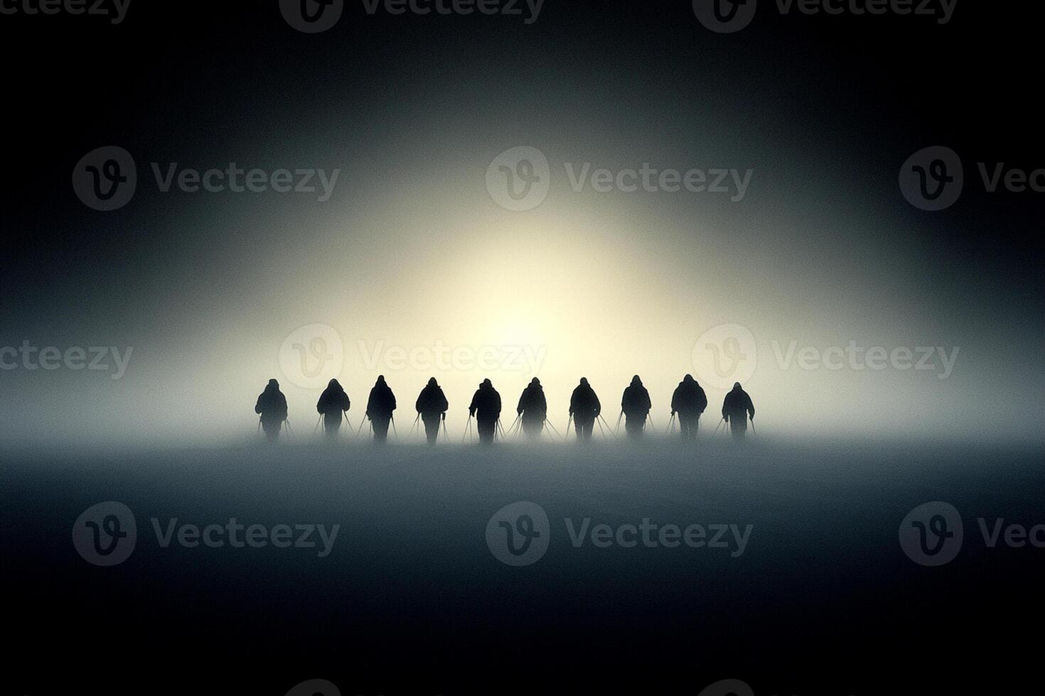 A group of people standing in a foggy field photo