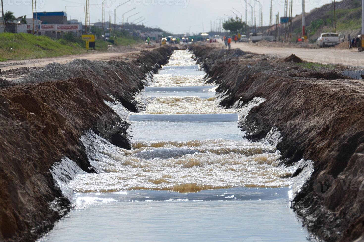 A long trench with water flowing down it photo