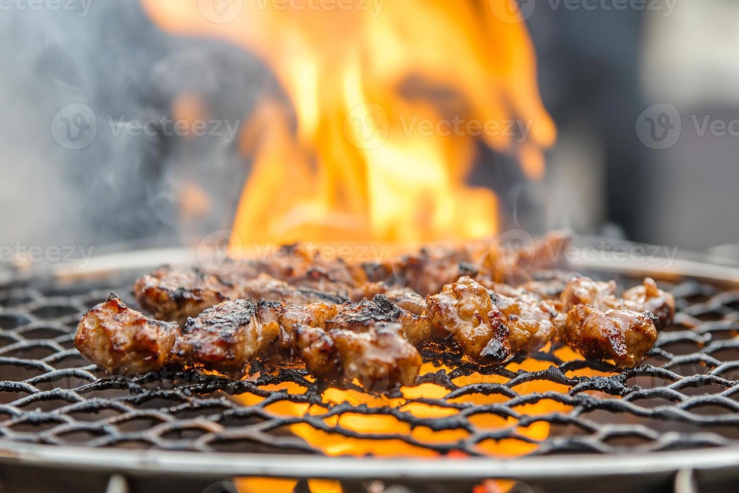 A close up of meat being cooked on a grill photo