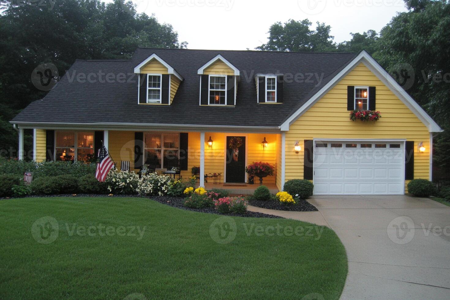 A yellow house with black trim photo