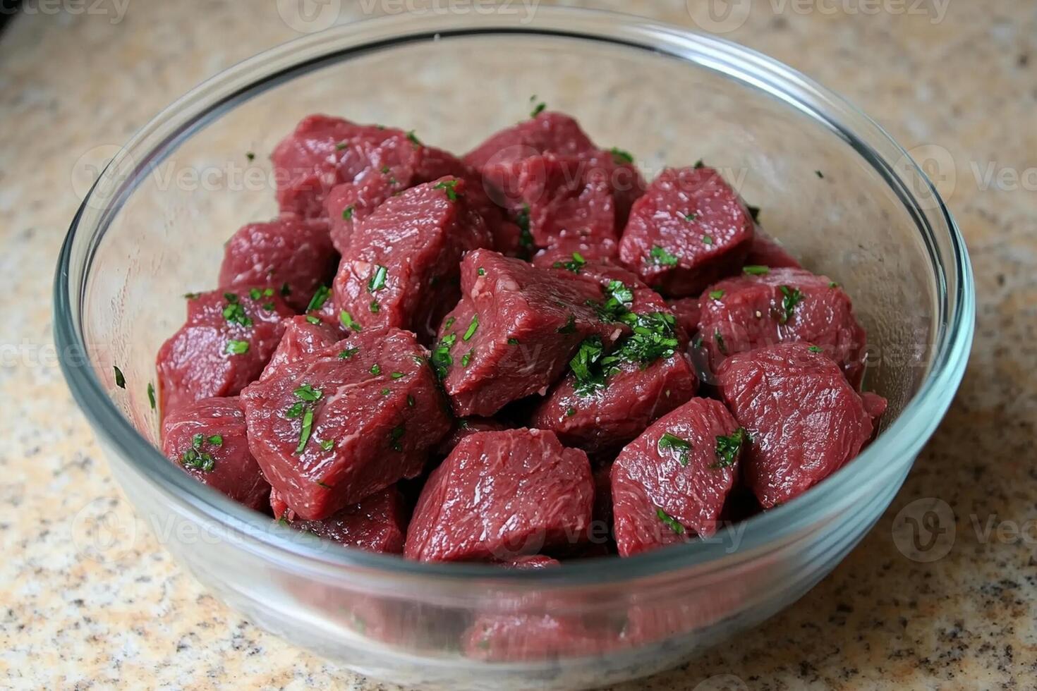 A bowl of raw beef with herbs in it photo