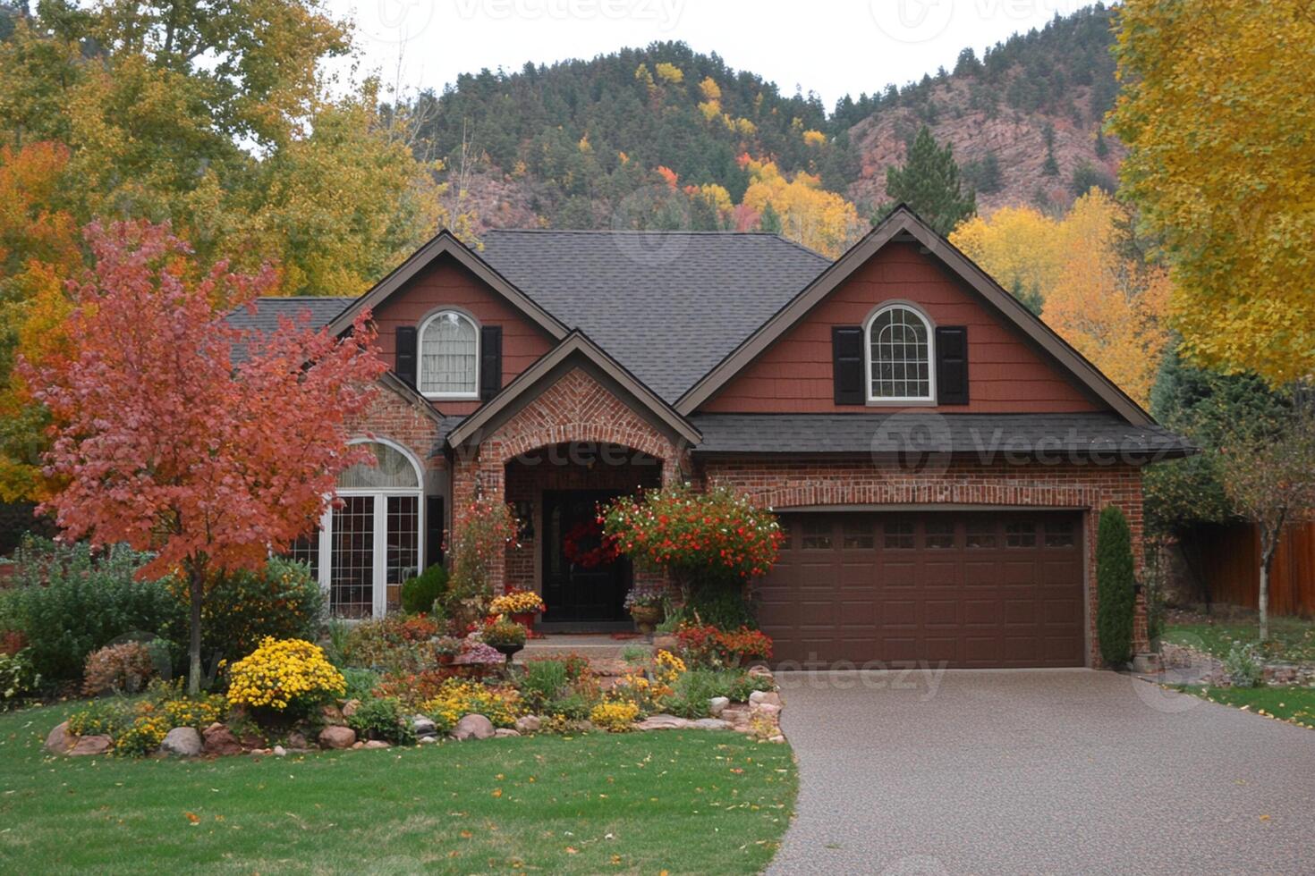 A large house with a driveway and a garage photo