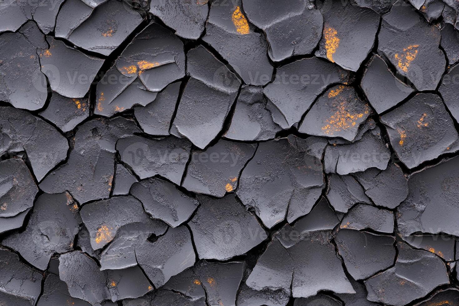 A close up of a cracked wall with some paint on it photo