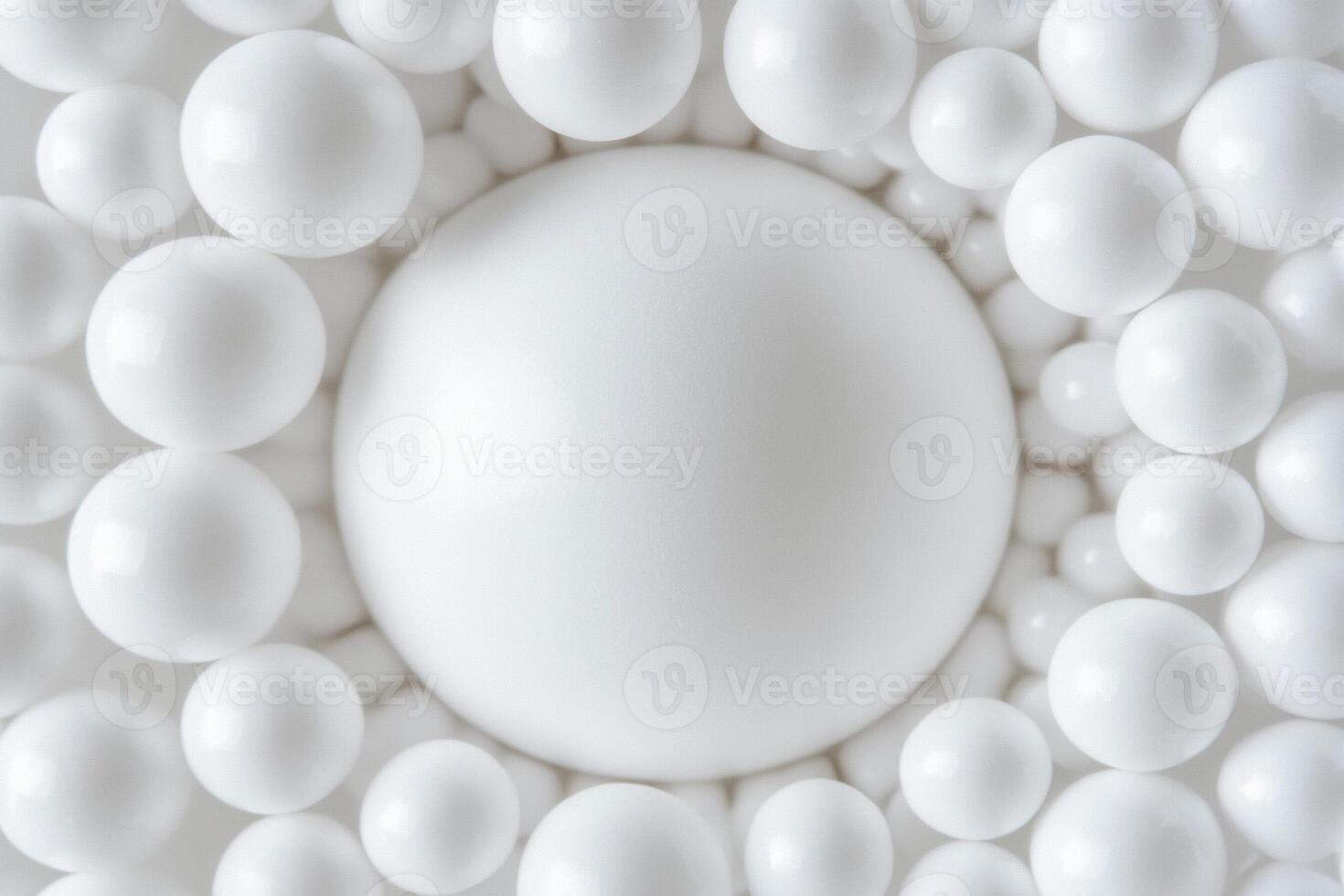 A white sphere surrounded by many small balls photo