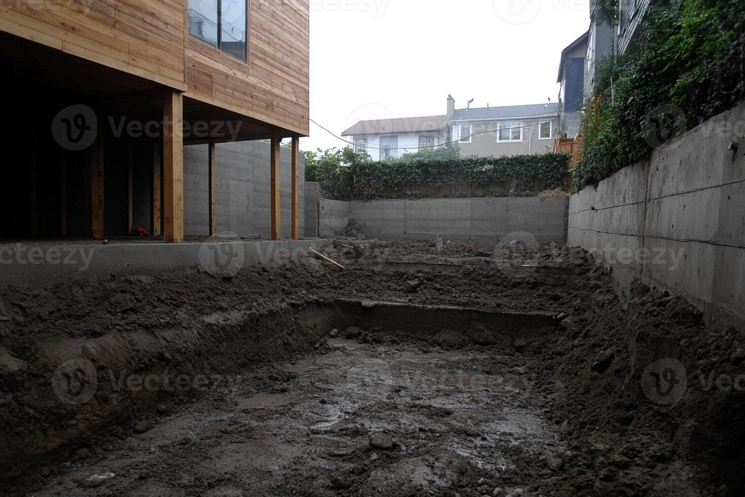 A large concrete pit in the middle of a yard photo