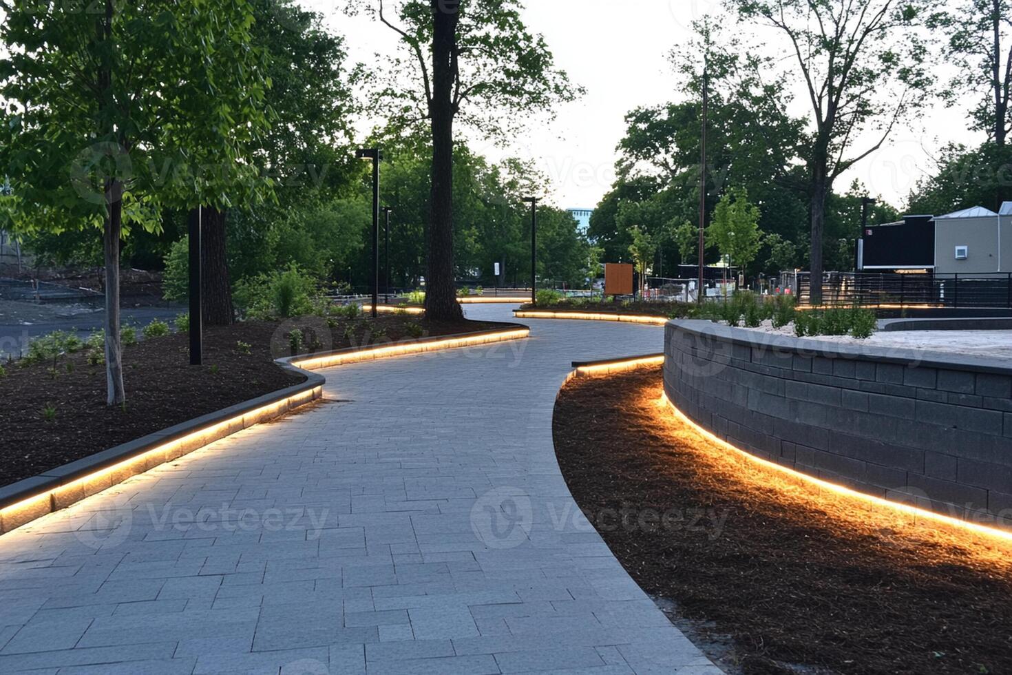 A walkway with lights on it at dusk photo