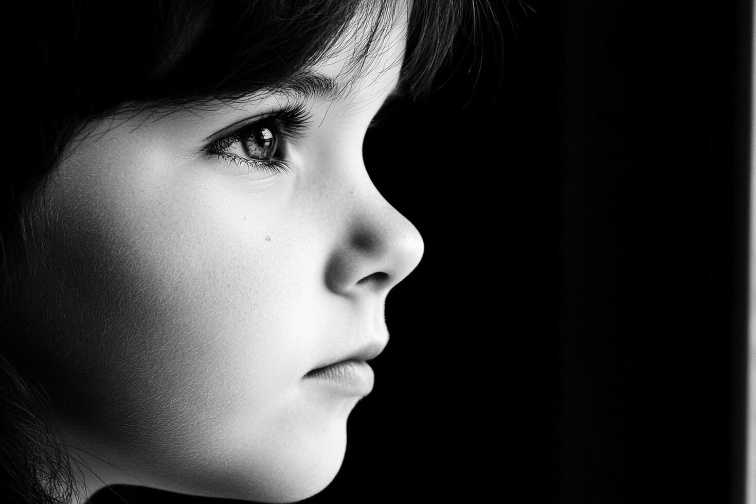 A black and white photo of a young girl