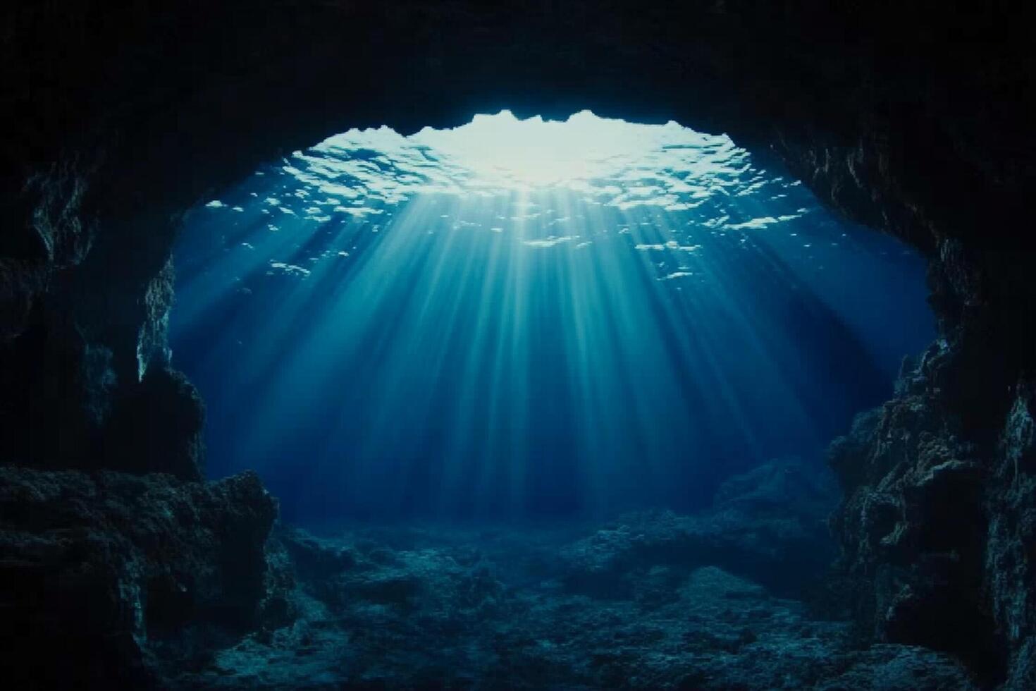 The sun shines through the cave entrance photo