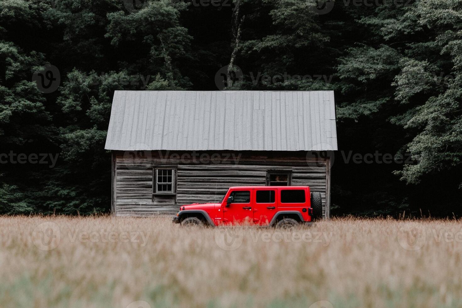 A red jeep parked in front of a cabin photo
