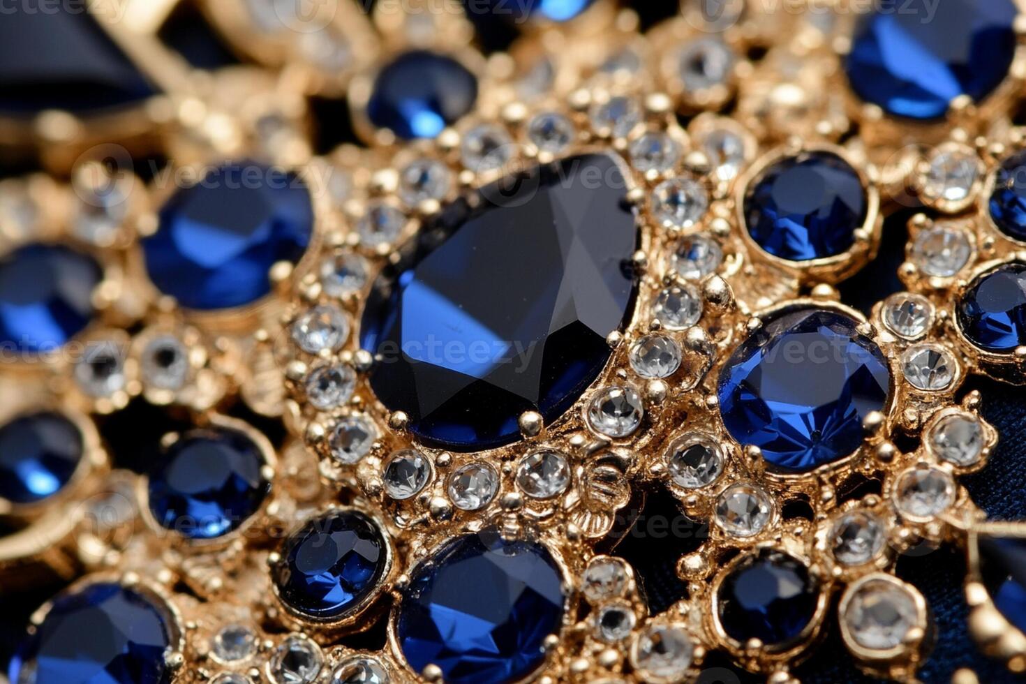 A close up of a blue and gold brooch photo