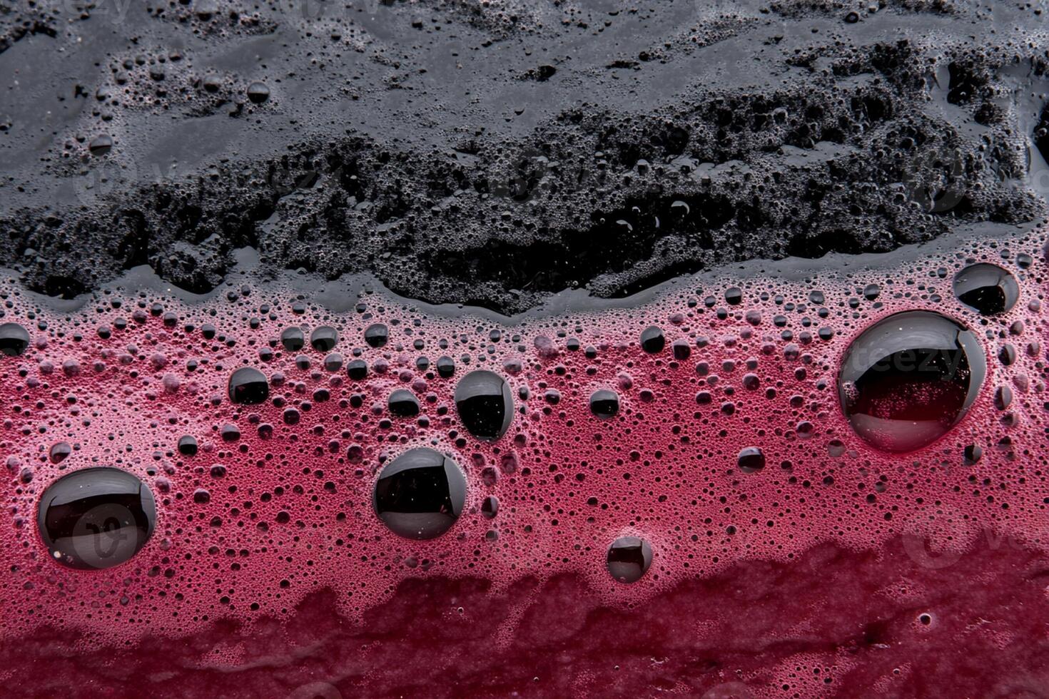 A close up of a red liquid with bubbles photo