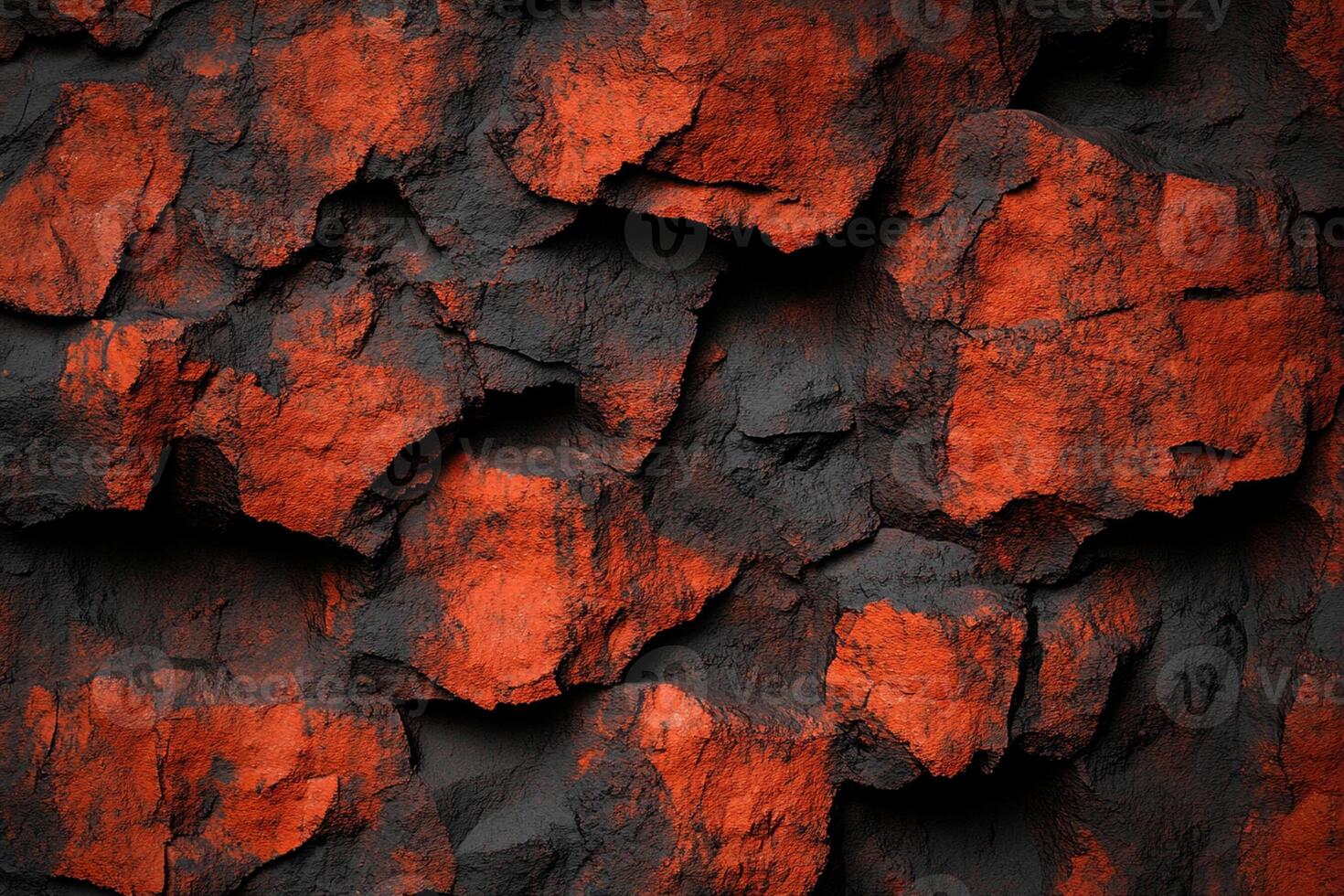 A close up of a rock wall with red and black paint photo