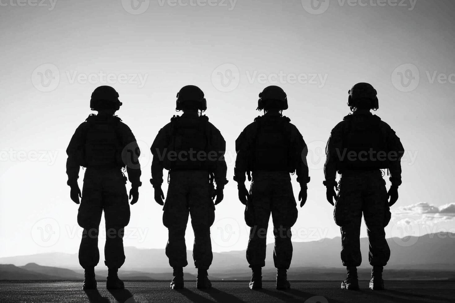 Three soldiers stand in a line in the desert photo