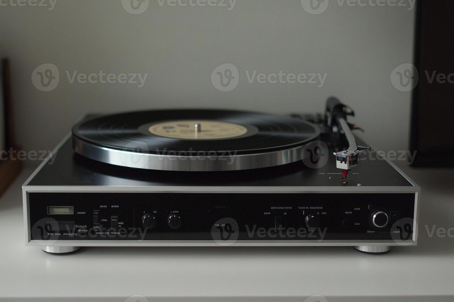 A turntable sitting on top of a white table photo