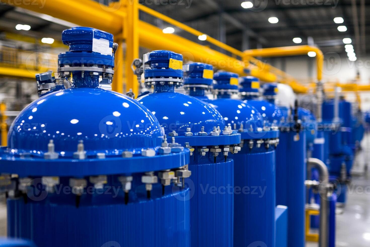 Blue water tanks in a factory photo