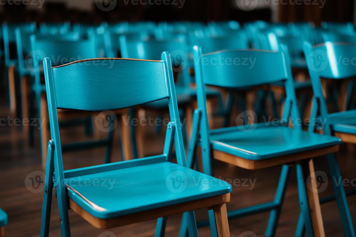 Rows of blue chairs in a room photo