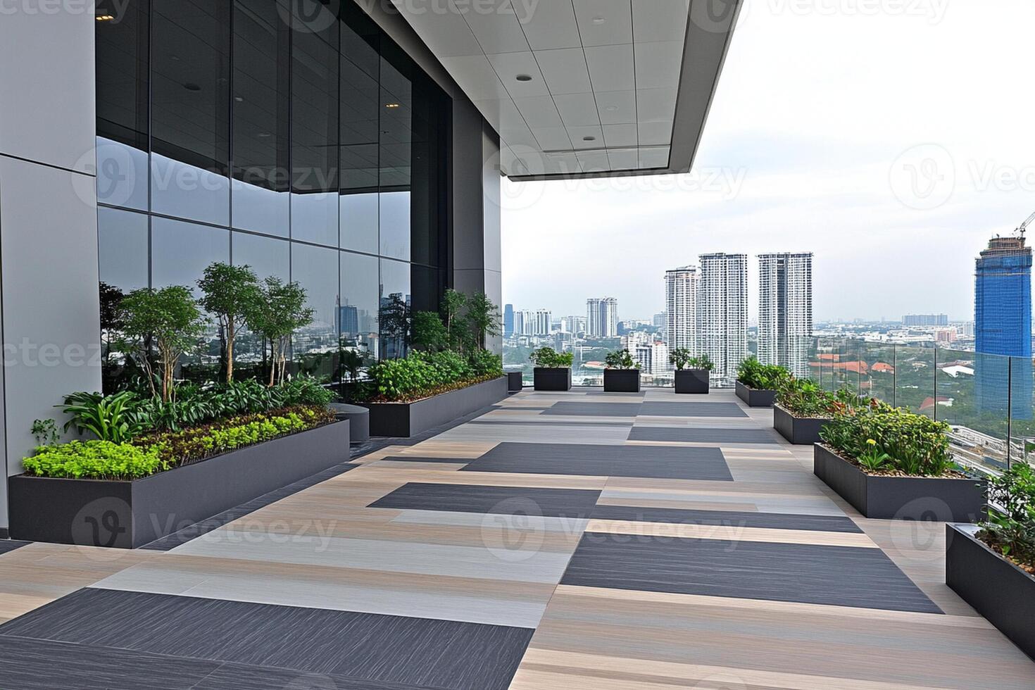 A balcony with planters and a view of the city photo
