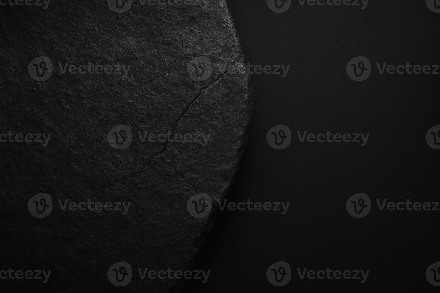 a black rock with a crack in it photo