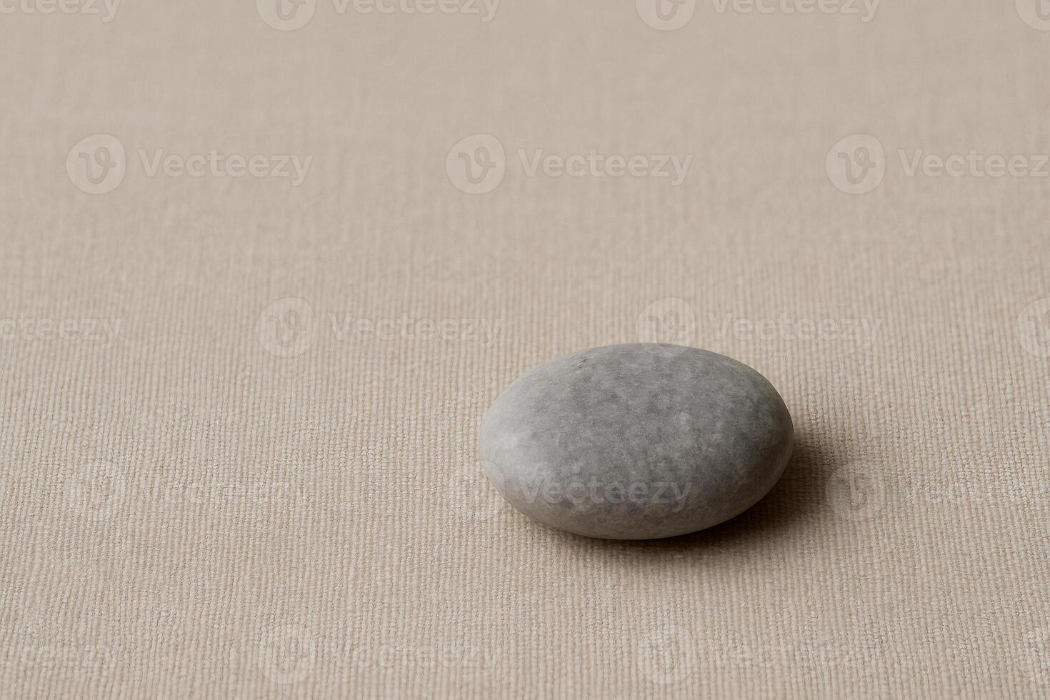 a stone on a beige background photo