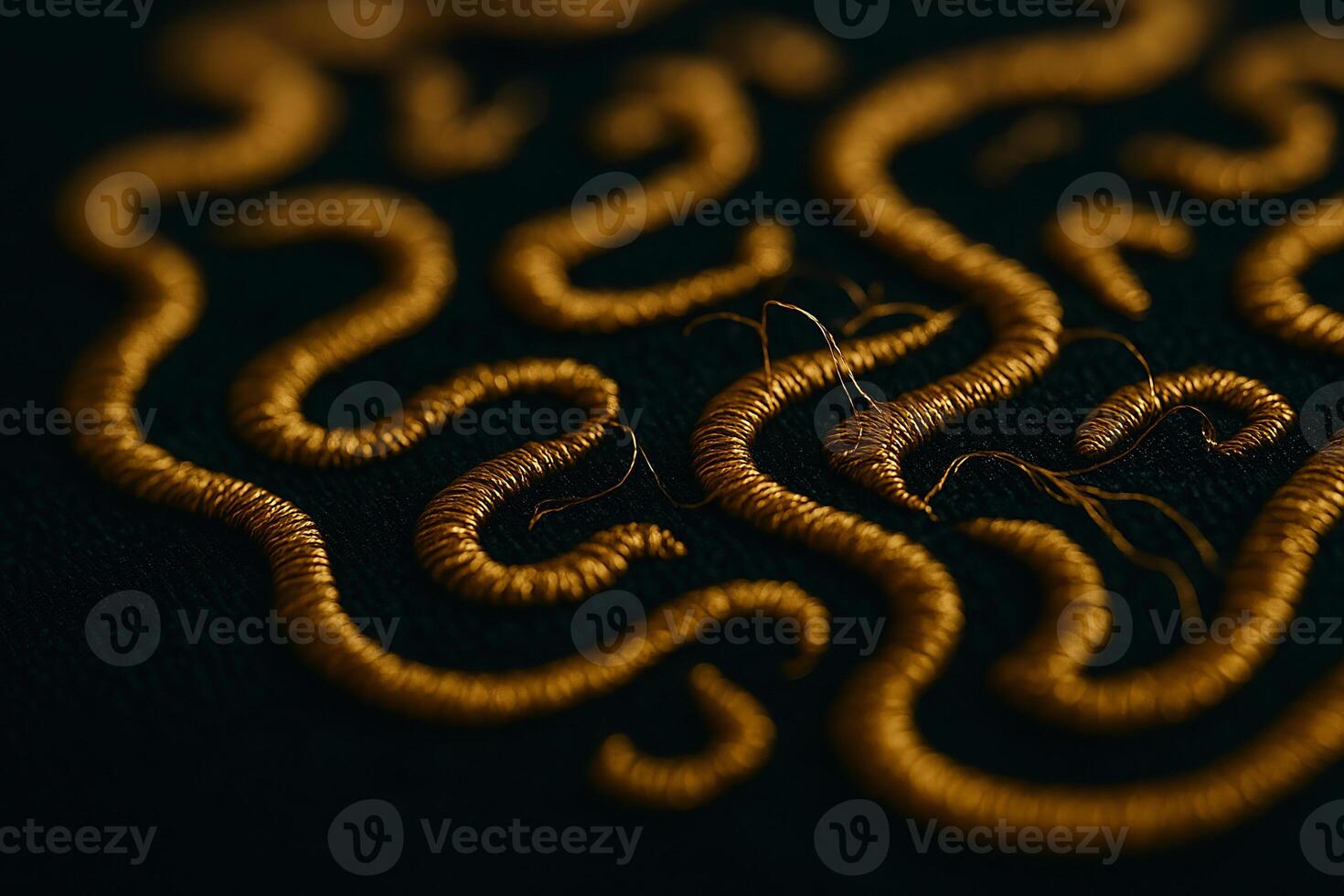 a close up of a gold embroidered design photo