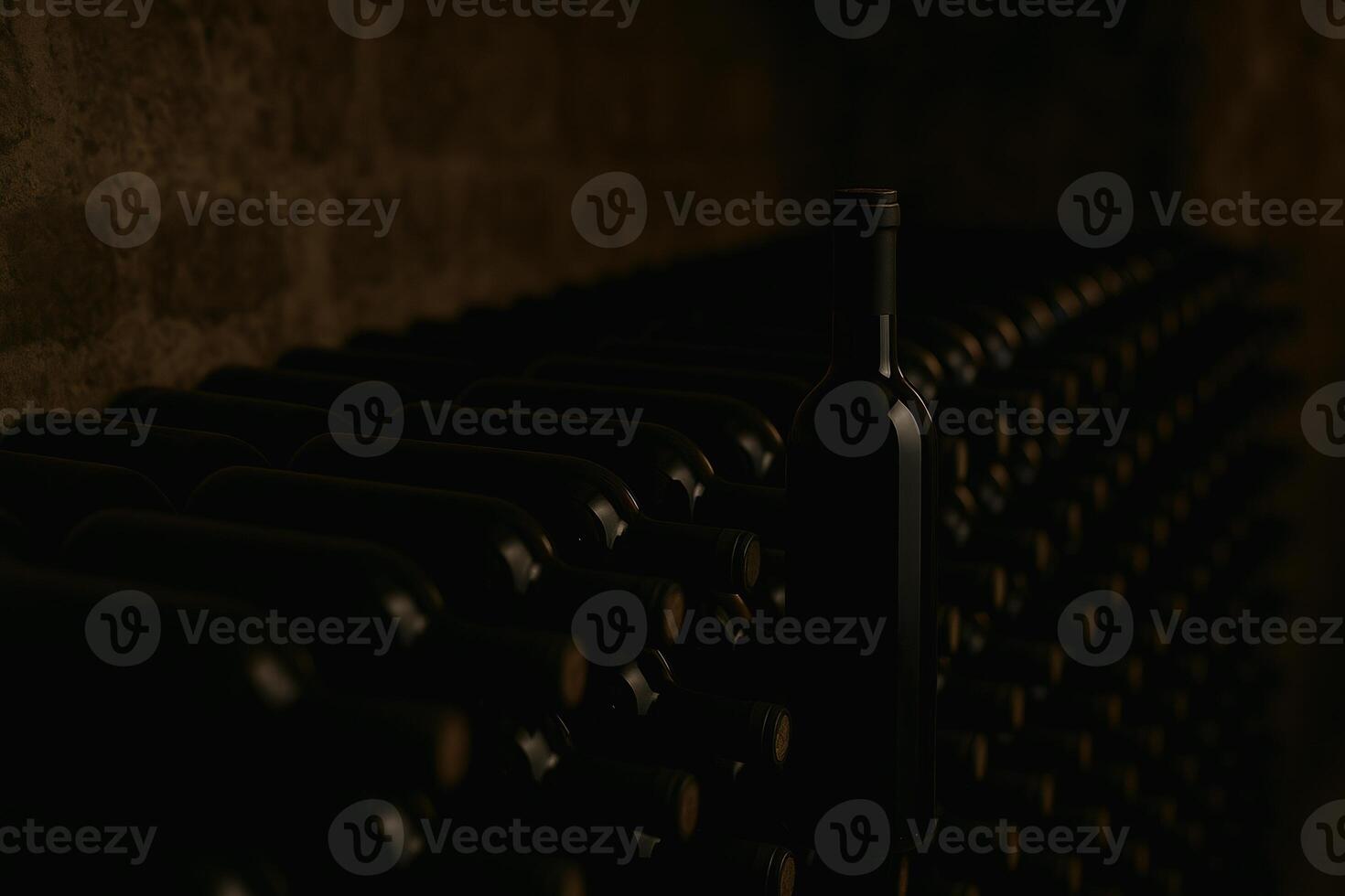 a bottle of wine sitting on a shelf photo