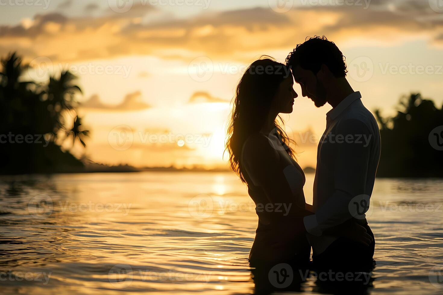 Romantic couple sharing intimate moment at sunset in tropical paradise photo