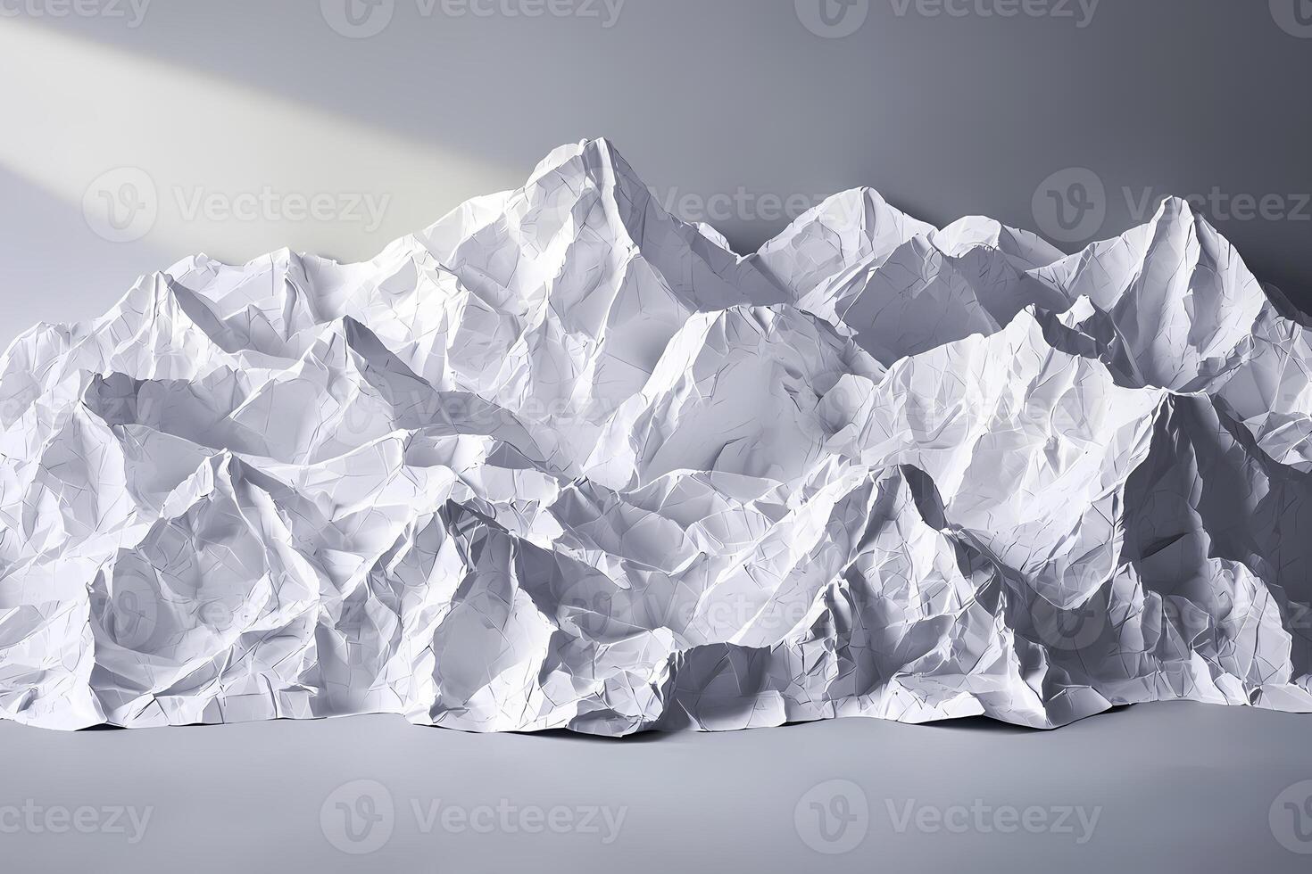 Crumpled paper resembling mountain range in studio setting photo
