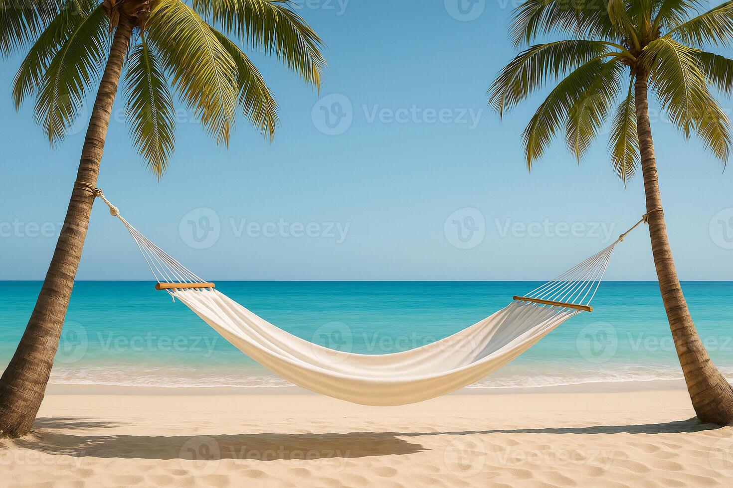 hammock on the beach with two palm trees photo