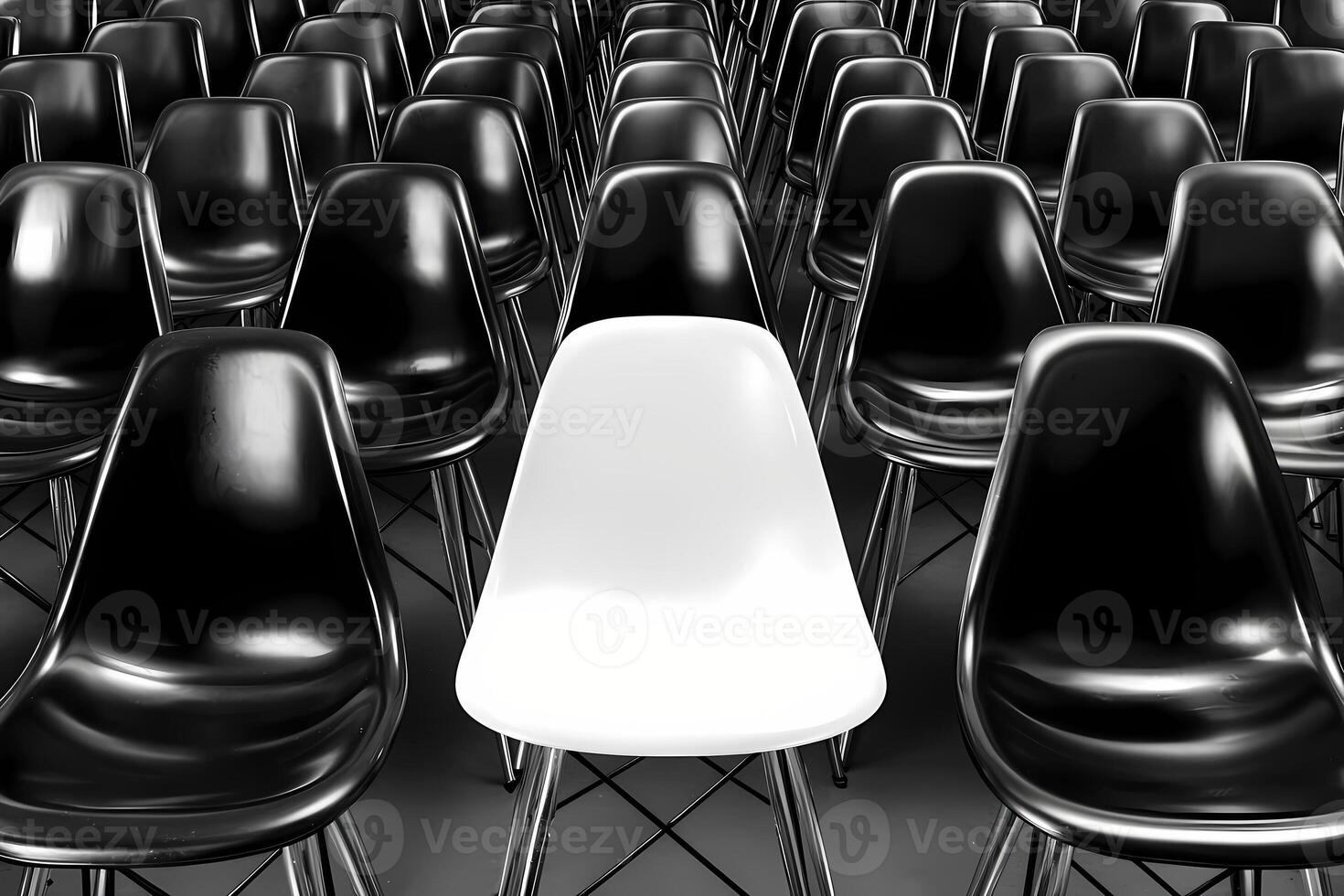 White chair standing out from the crowd of black chairs photo
