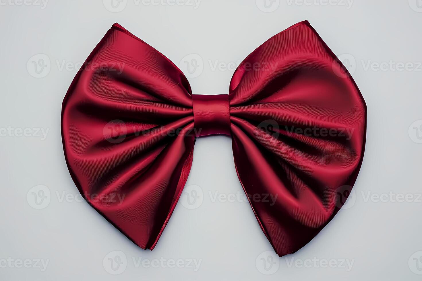Elegant red bow tie on plain background symbolizing celebration photo