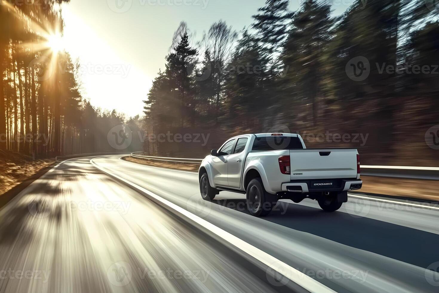 White pickup truck driving on scenic highway at sunset. photo