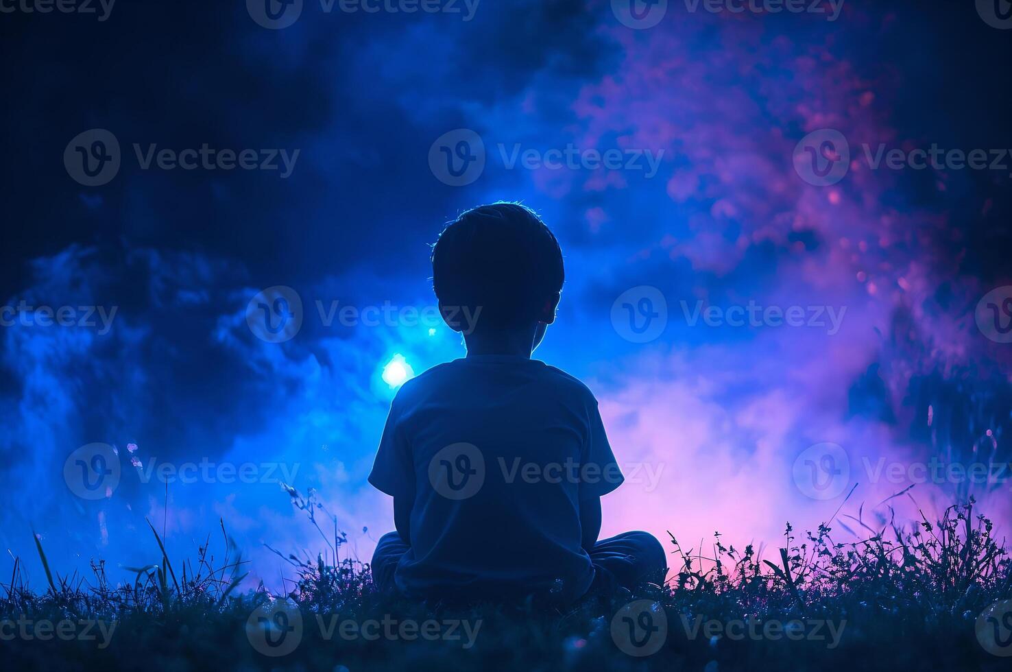 Child gazing at mystical night sky scenery photo