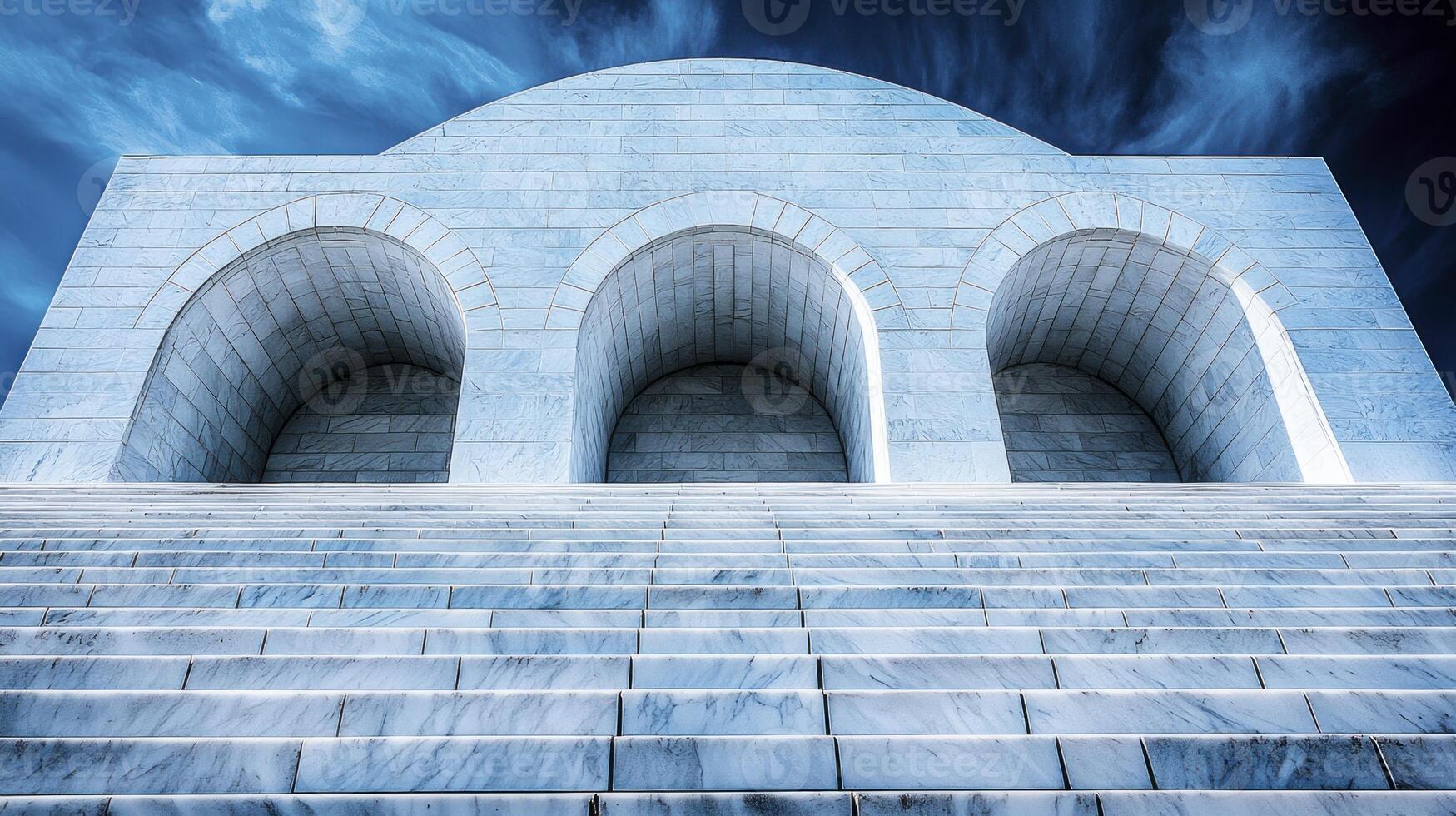 A white building with arches and stairs photo