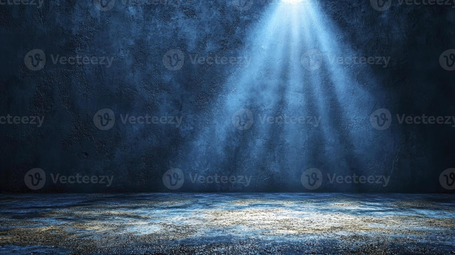 An empty room with a light shining through the ceiling photo