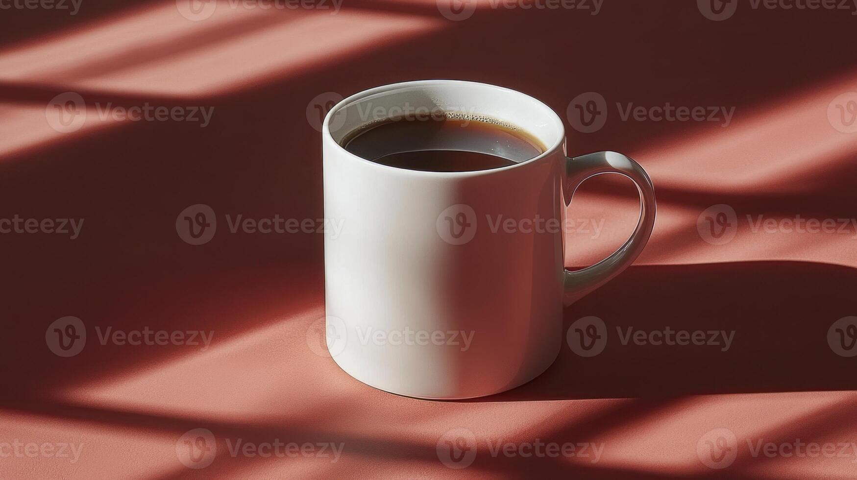 A cup of coffee on a red surface photo