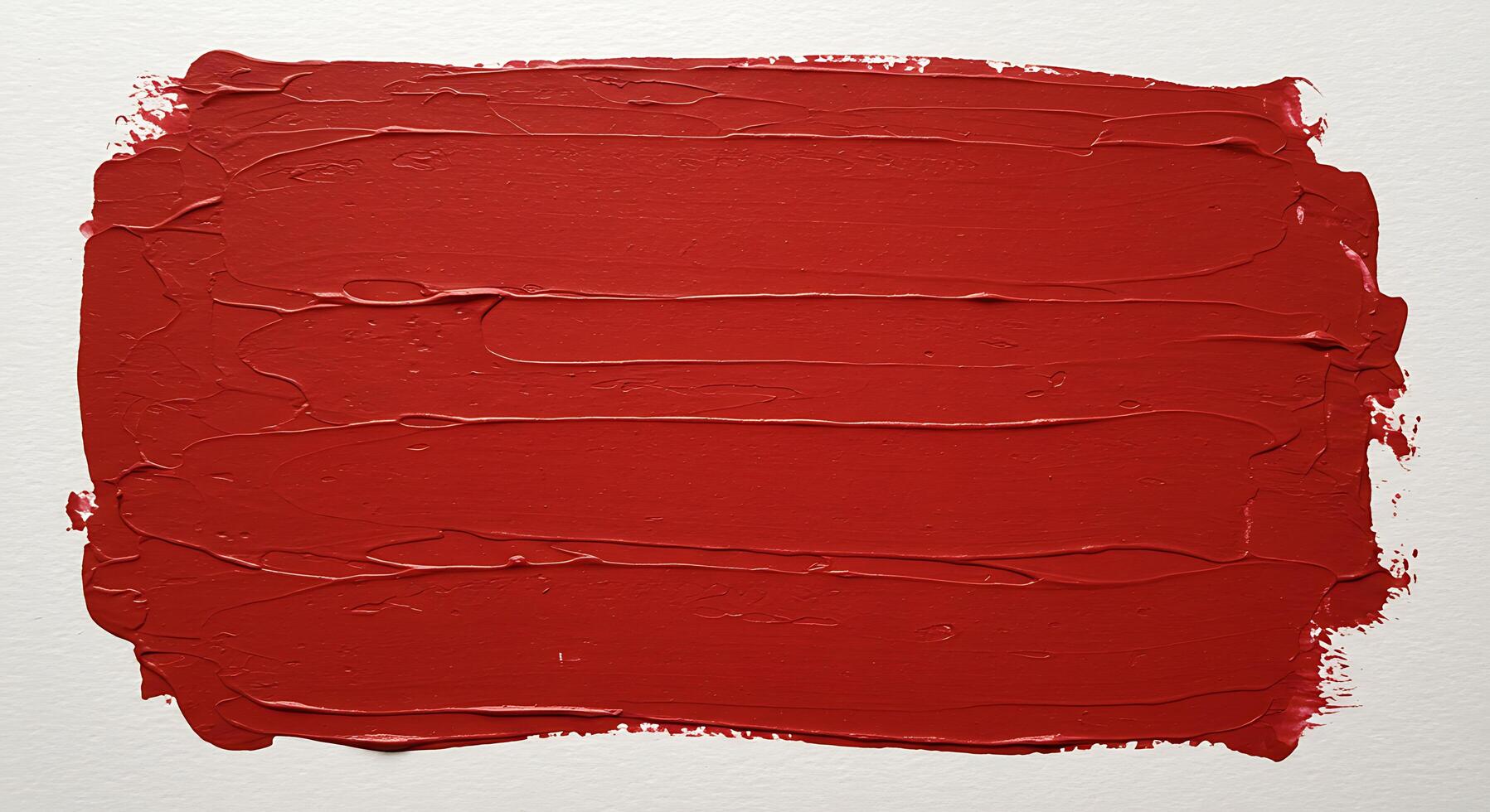 A red paint brush on a white surface photo